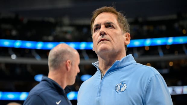 Dallas Mavericks owner Mark Cuban looks on during a basketball game.